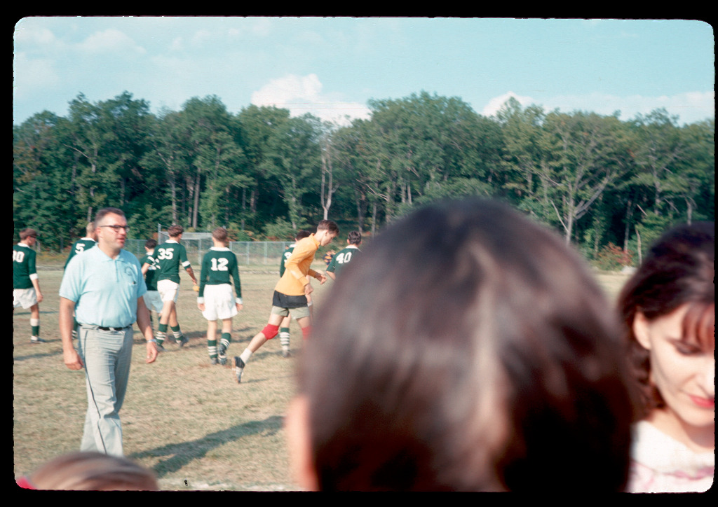 Senior year soccer, coach is on the left in blue